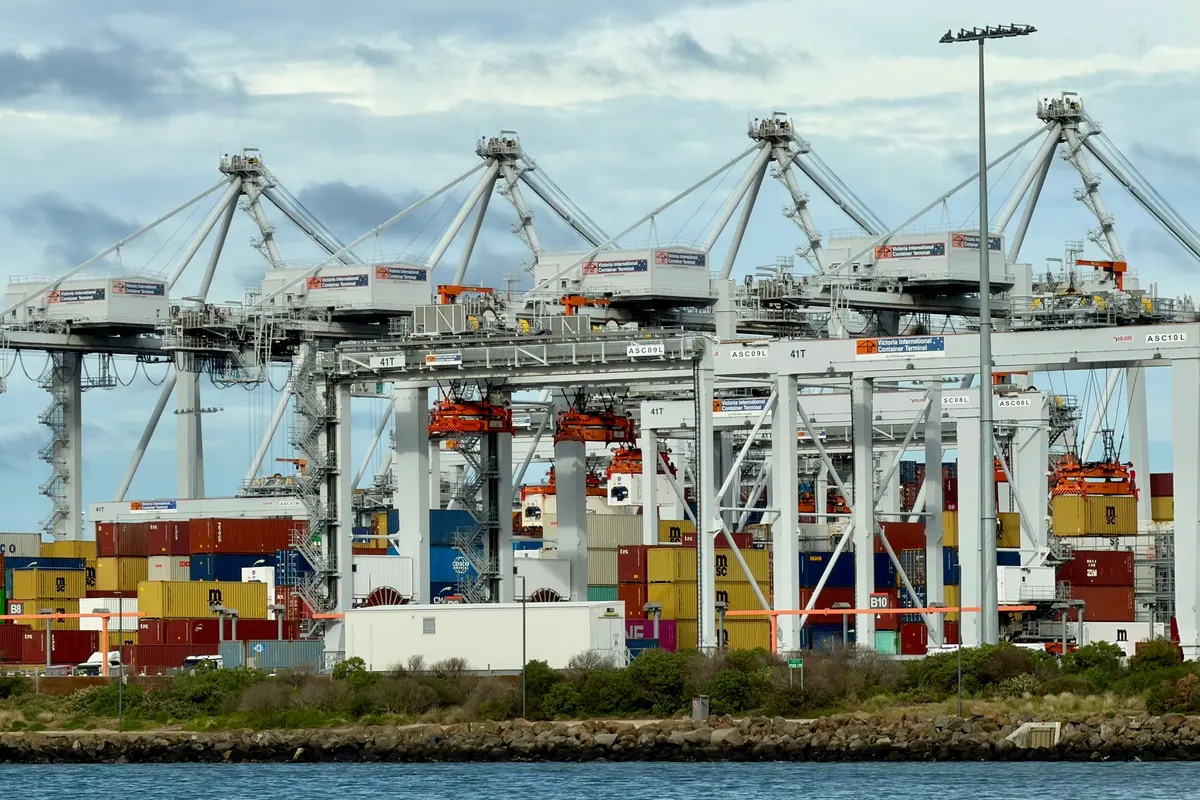Automated container terminal with gantry cranes handling yard equipment